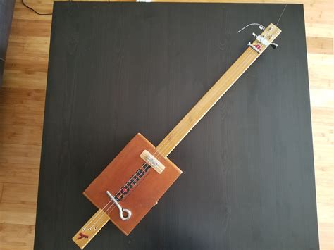 metal or nylon for electrified cigar box guitar|cigar box guitar.